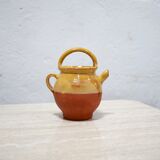 Old gargoulette pot in glazed terracotta