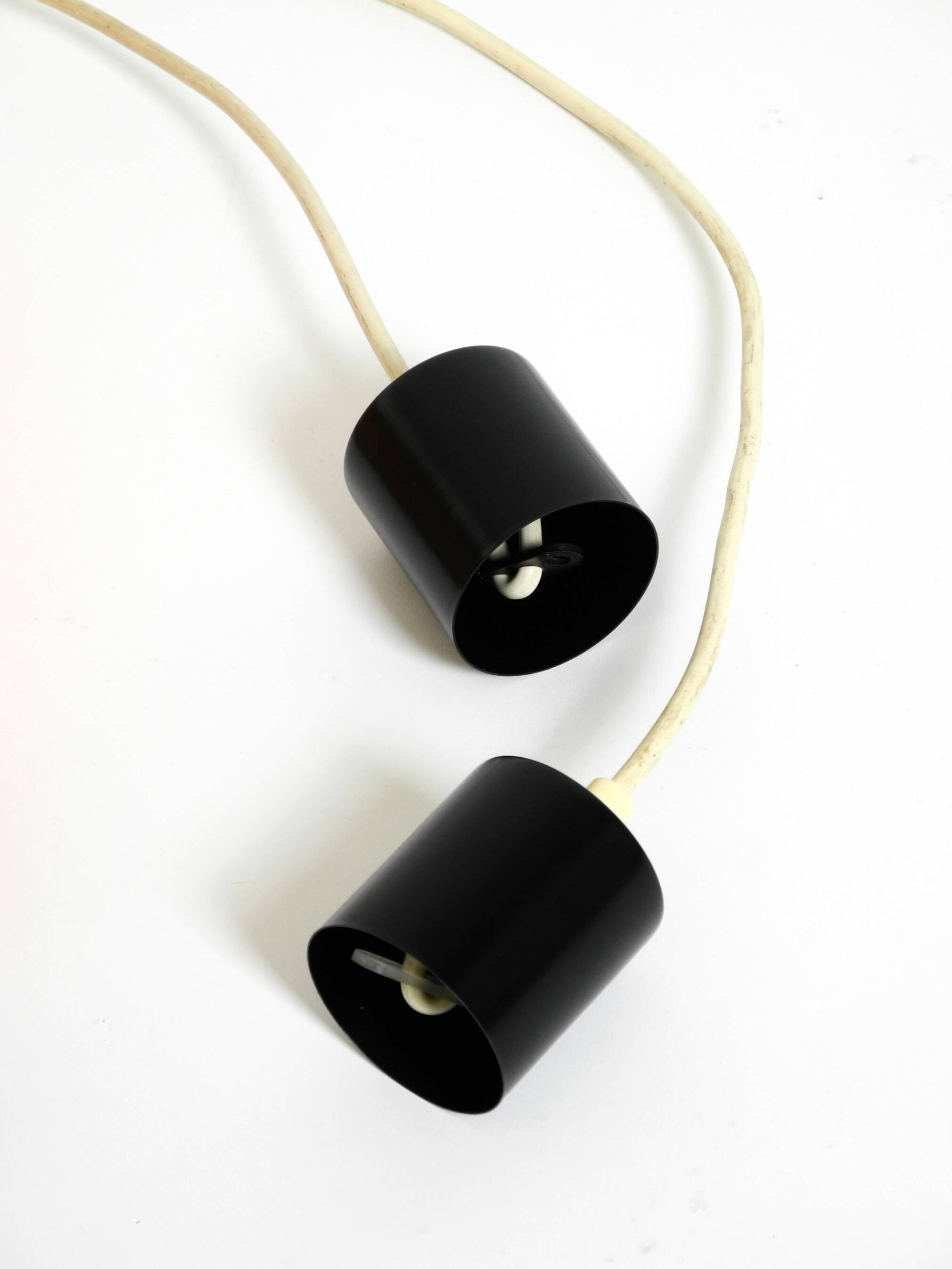 Two 50s tube pendant lamps consisting of two screwed-together copper bowls