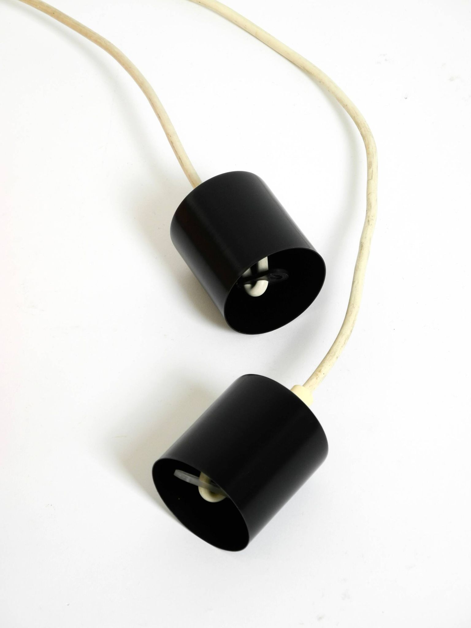 Two 50s tube pendant lamps consisting of two screwed-together copper bowls
