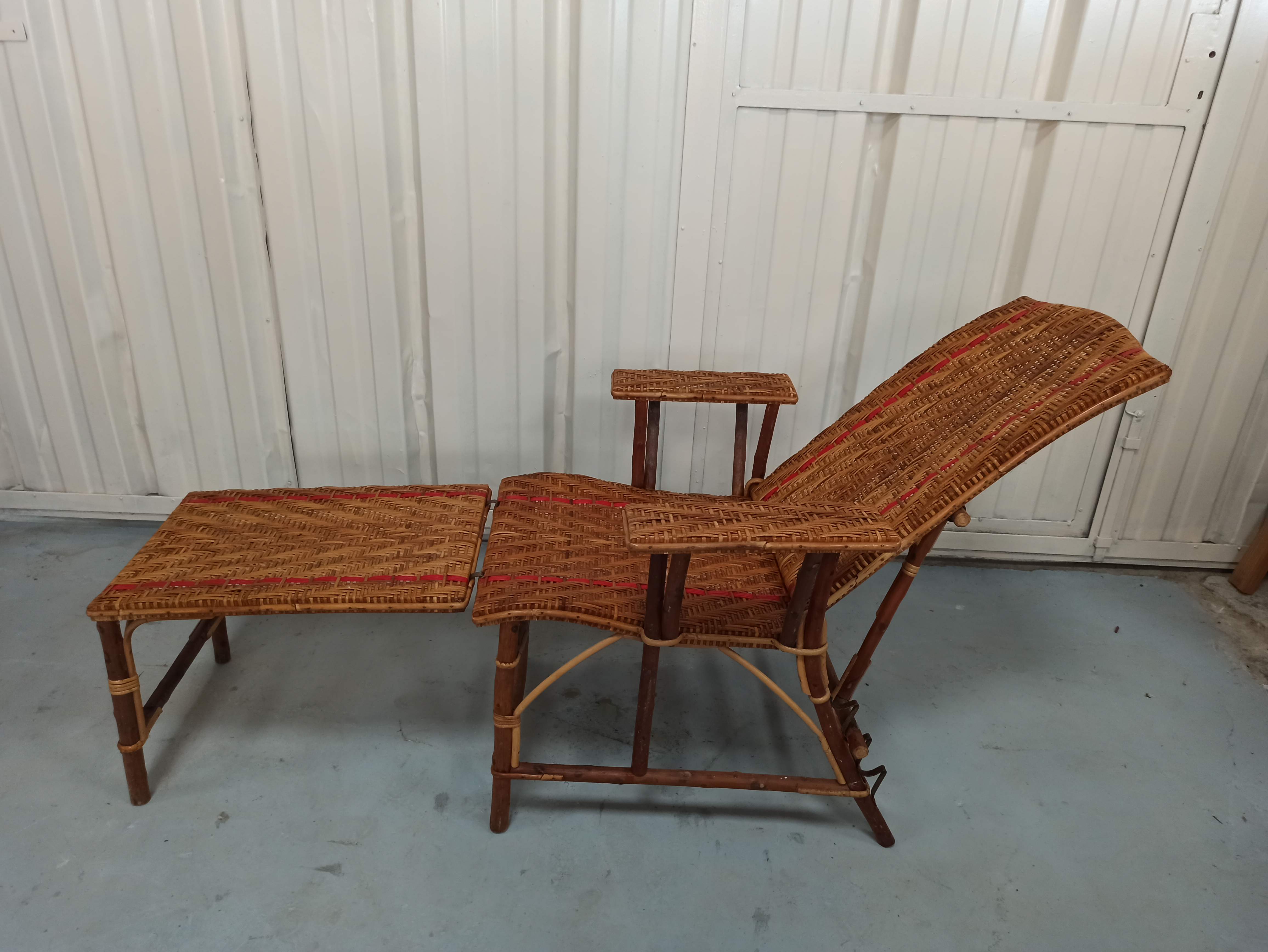 Sunbathing sunbathing in wicker rattan wood deckchair red lounger