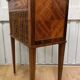 Side table with a faux book front.