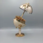 Vintage brass globe cigarette dispenser