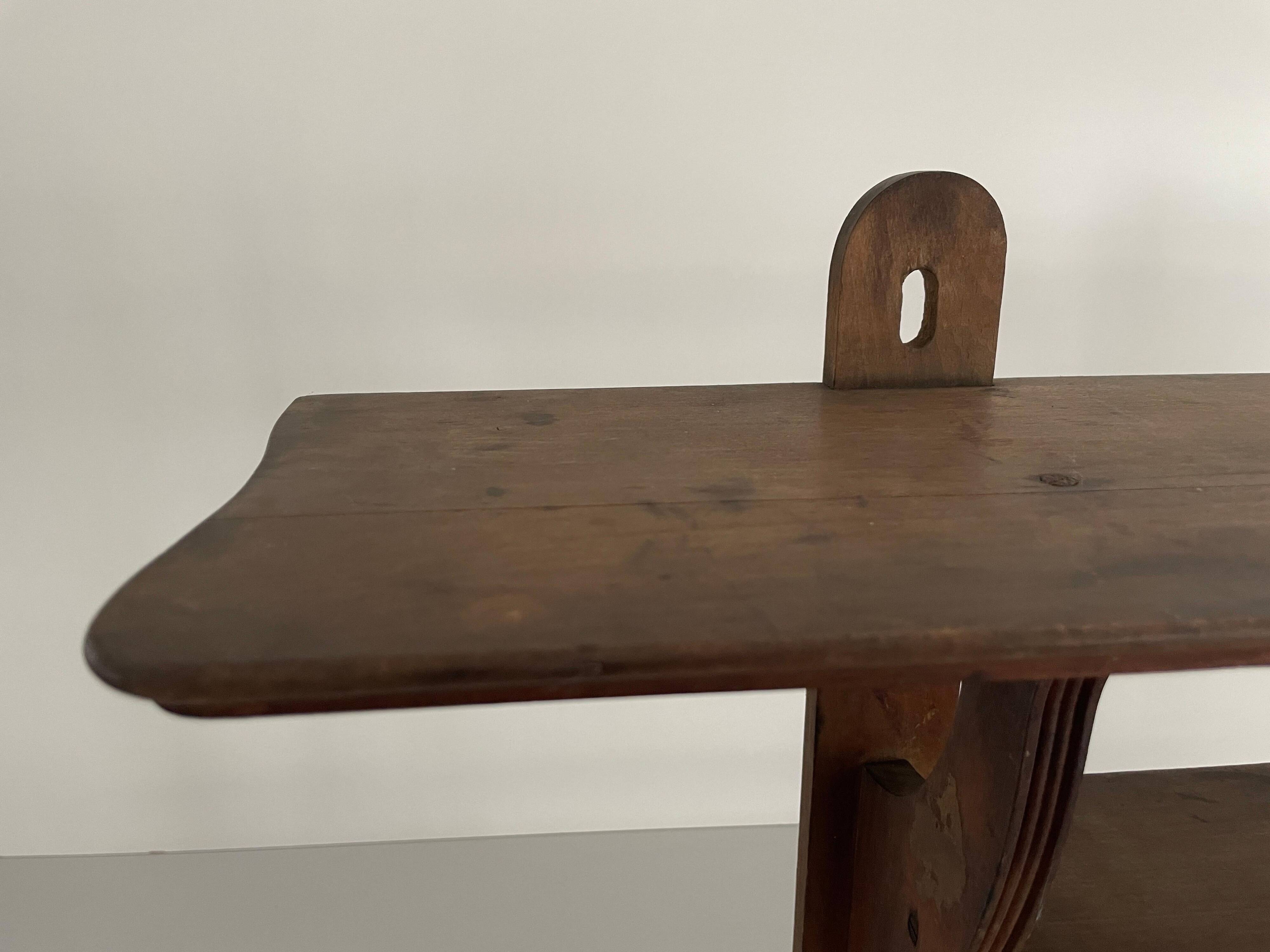 Art Deco wall shelf in wood with three levels, 1940s, Italy.