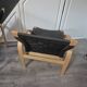 pair set of 2 armchairs with a wooden frame and black fabric weaving