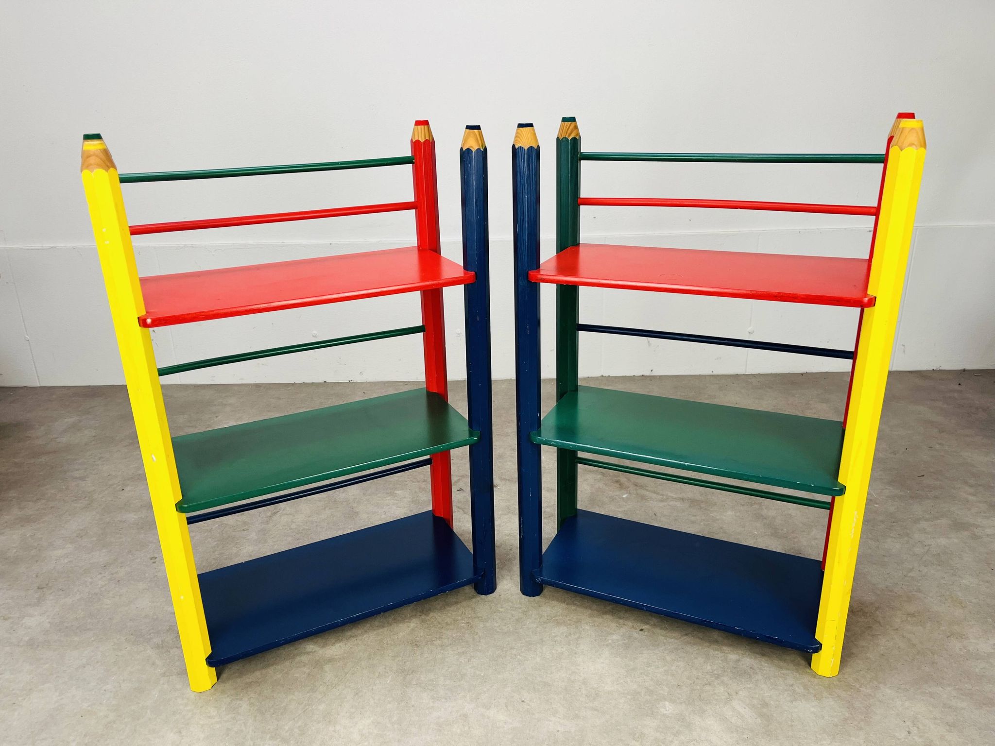 Pair of pencil-style shelves by Pierre Sala for children.