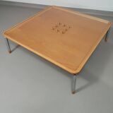Rare coffee table 110 x 110 x height 35 cm with 8 flange wooden / cork caps in the glass top.