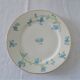 9 plates dessert porcelain of Limoges decorated with small blue flowers