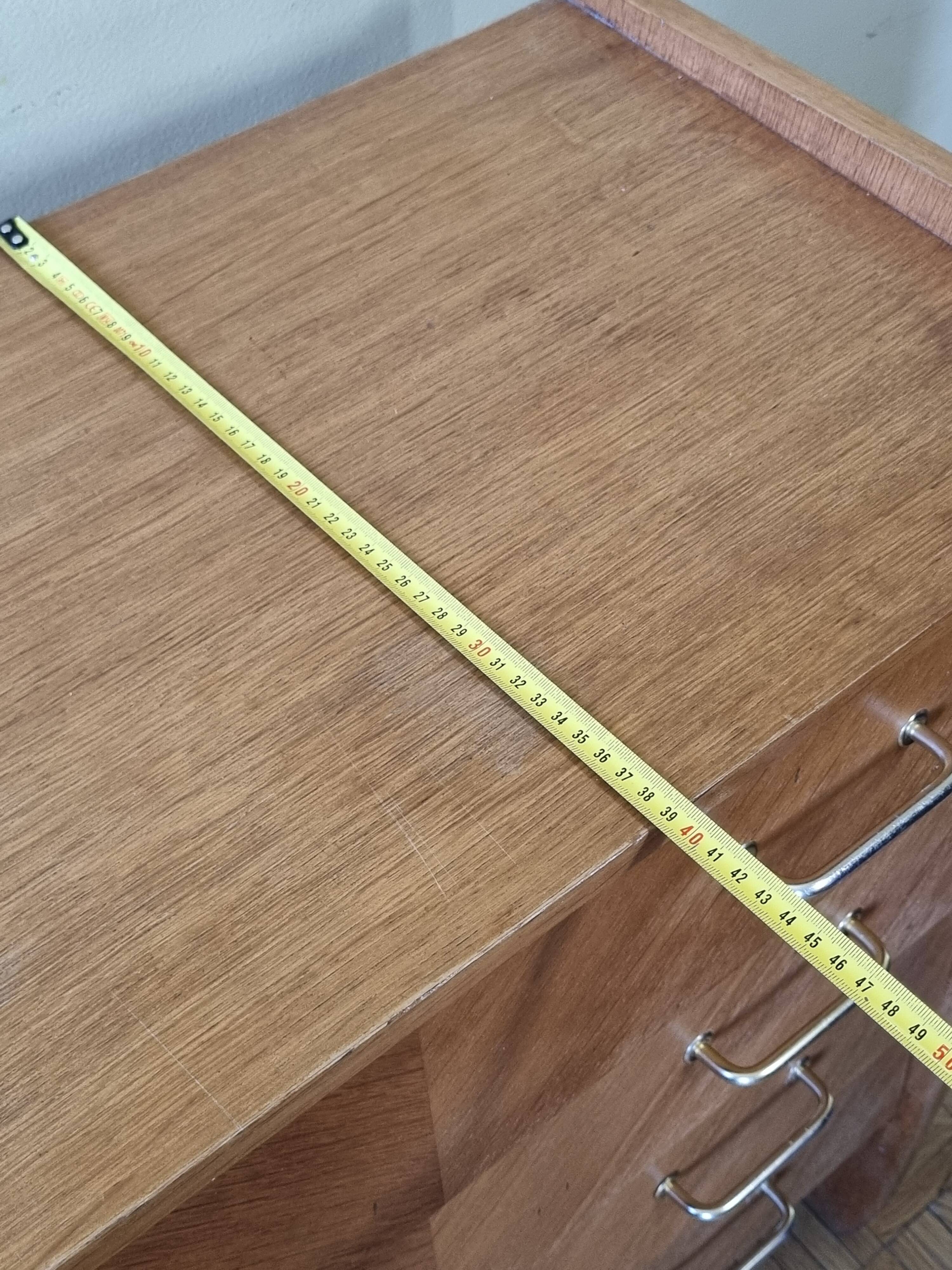 Vintage chest of drawers in modernist veneered wood from the 50s