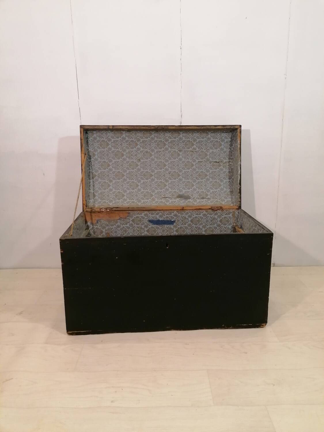 Large travel trunk in blackened wood