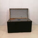 Large travel trunk in blackened wood