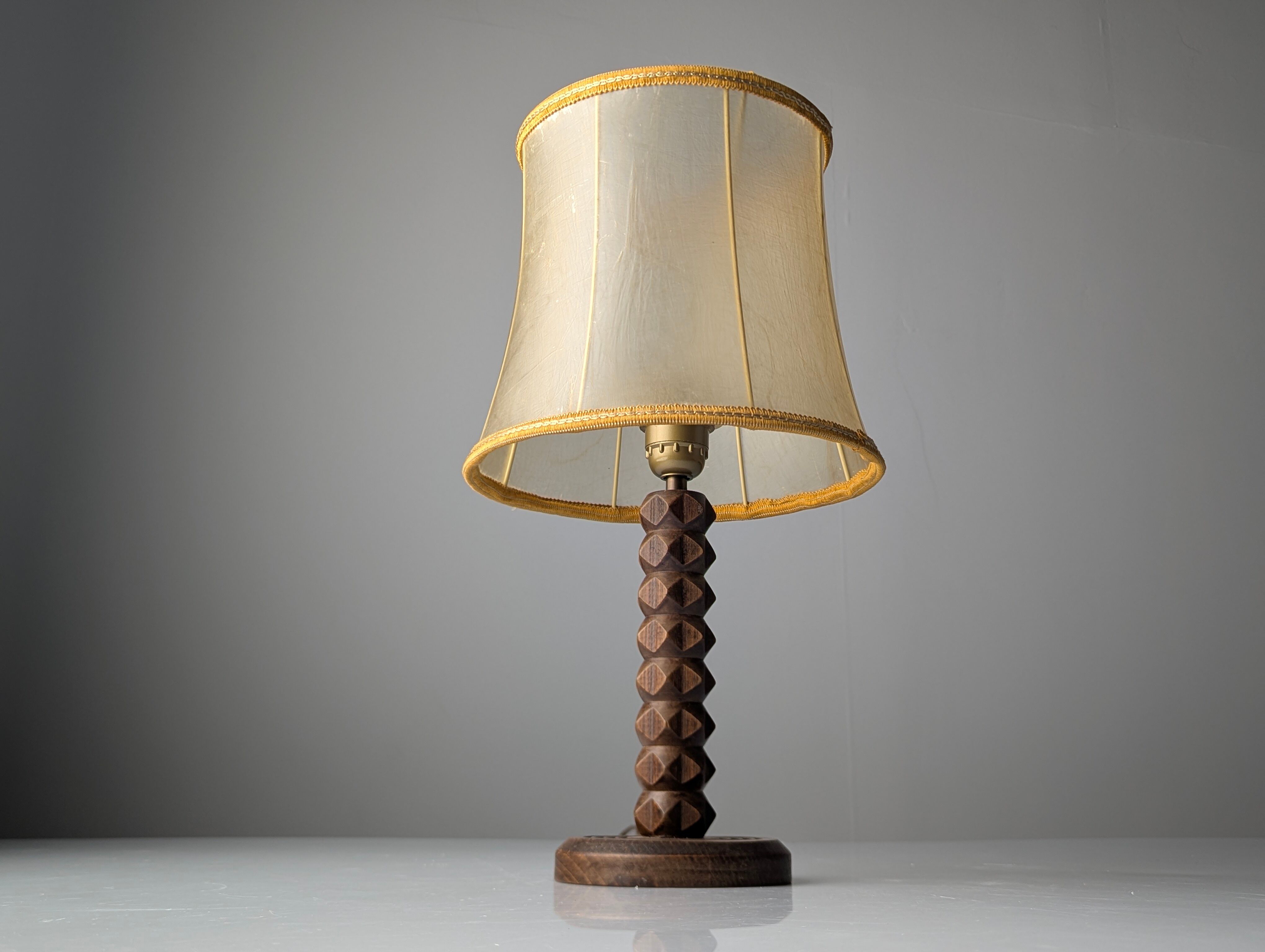 Charles Dudouyt oak table lamp with parchment shade, France, 1950s