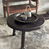 Small antique Indonesian bench in carved teak with plant and floral motifs.