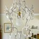 Brass chandelier with patinated tassels