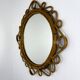 Miroir ovale en rotin et bambou espagnol, vers les années 1960.