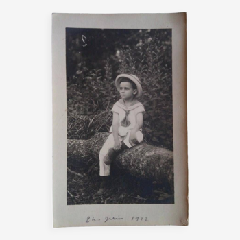 Boy as a sailor sitting on the trunk of a tree, 1922, France