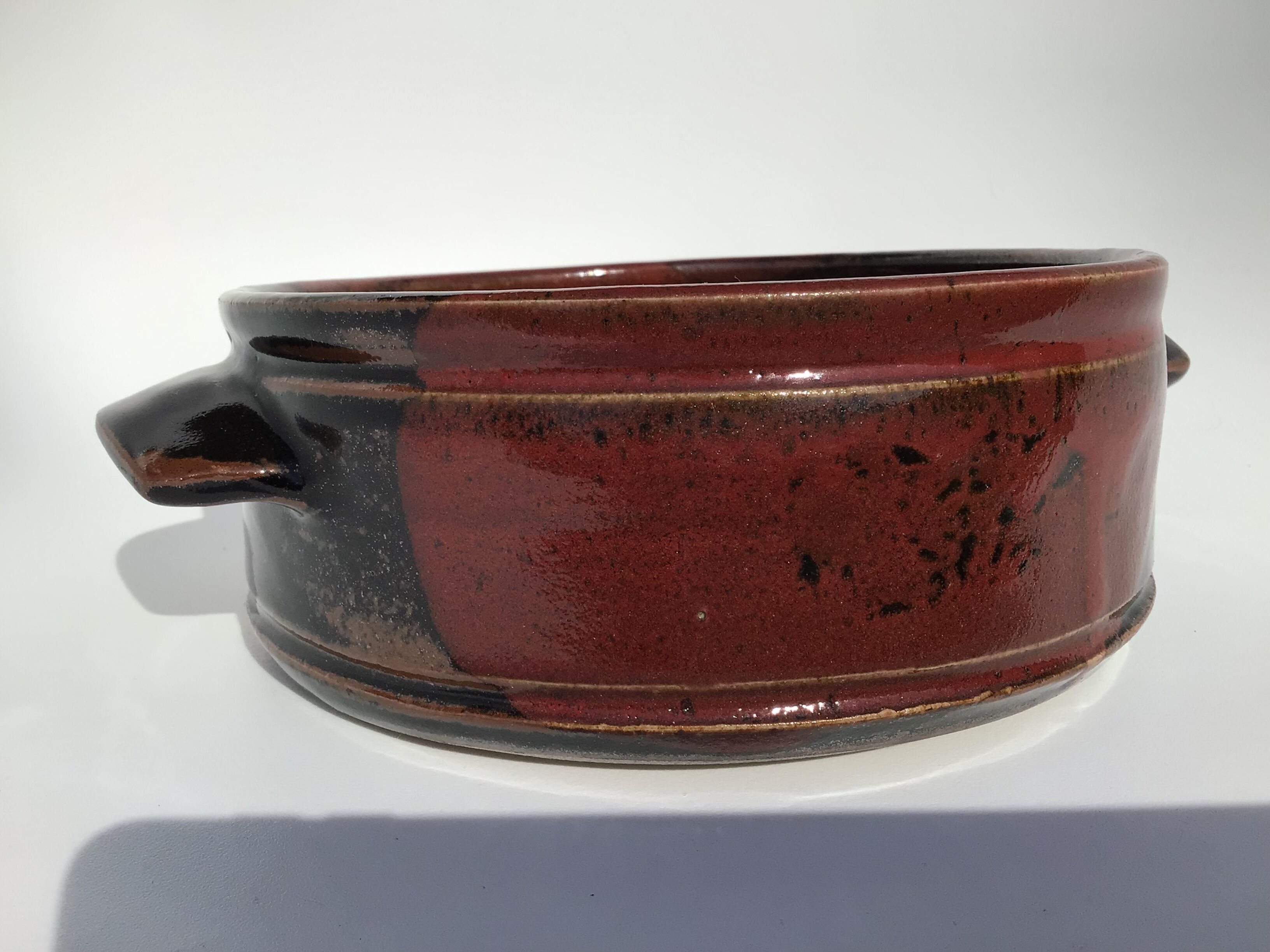 Artisanal sandstone dish signed Guibert red brown decorated