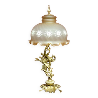 Table lamp with a tall base.