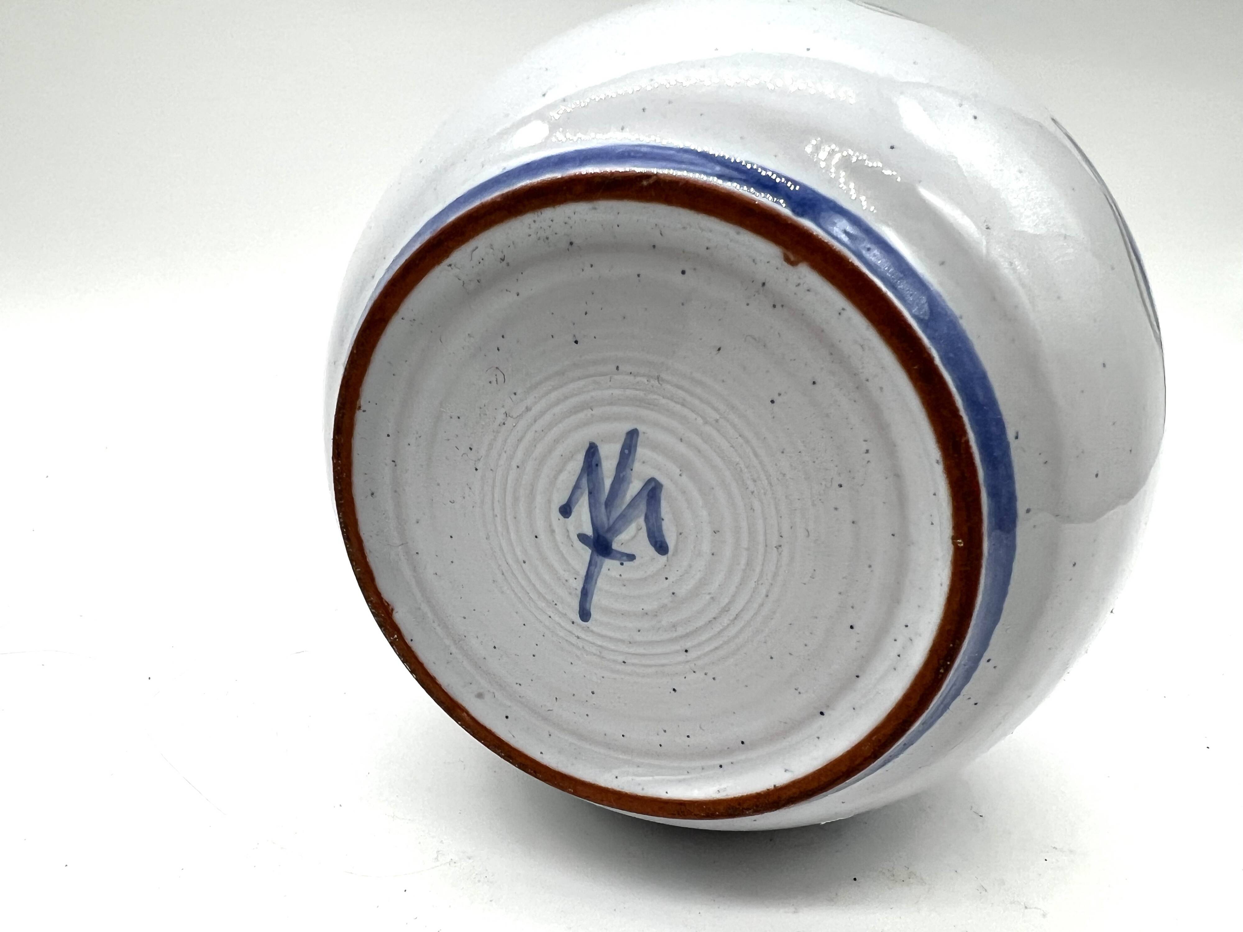 Blue glazed earthenware vase – stylized floral decoration – signed on the base