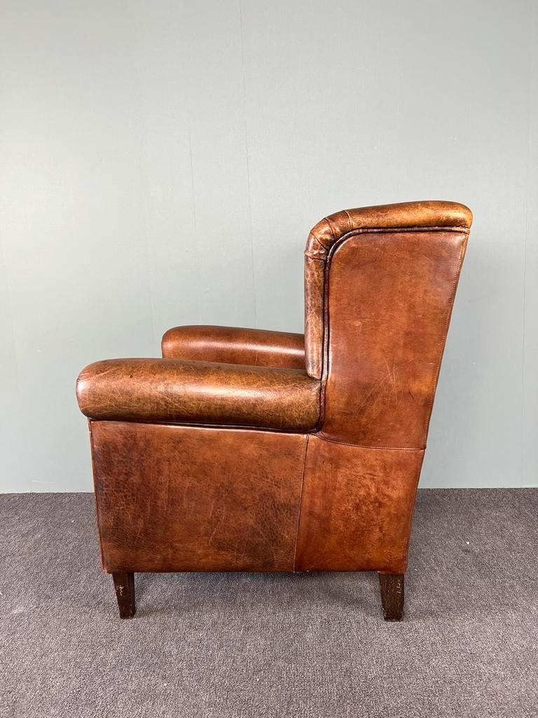 Vintage armchair in patinated sheep leather