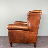 Vintage armchair in patinated sheep leather