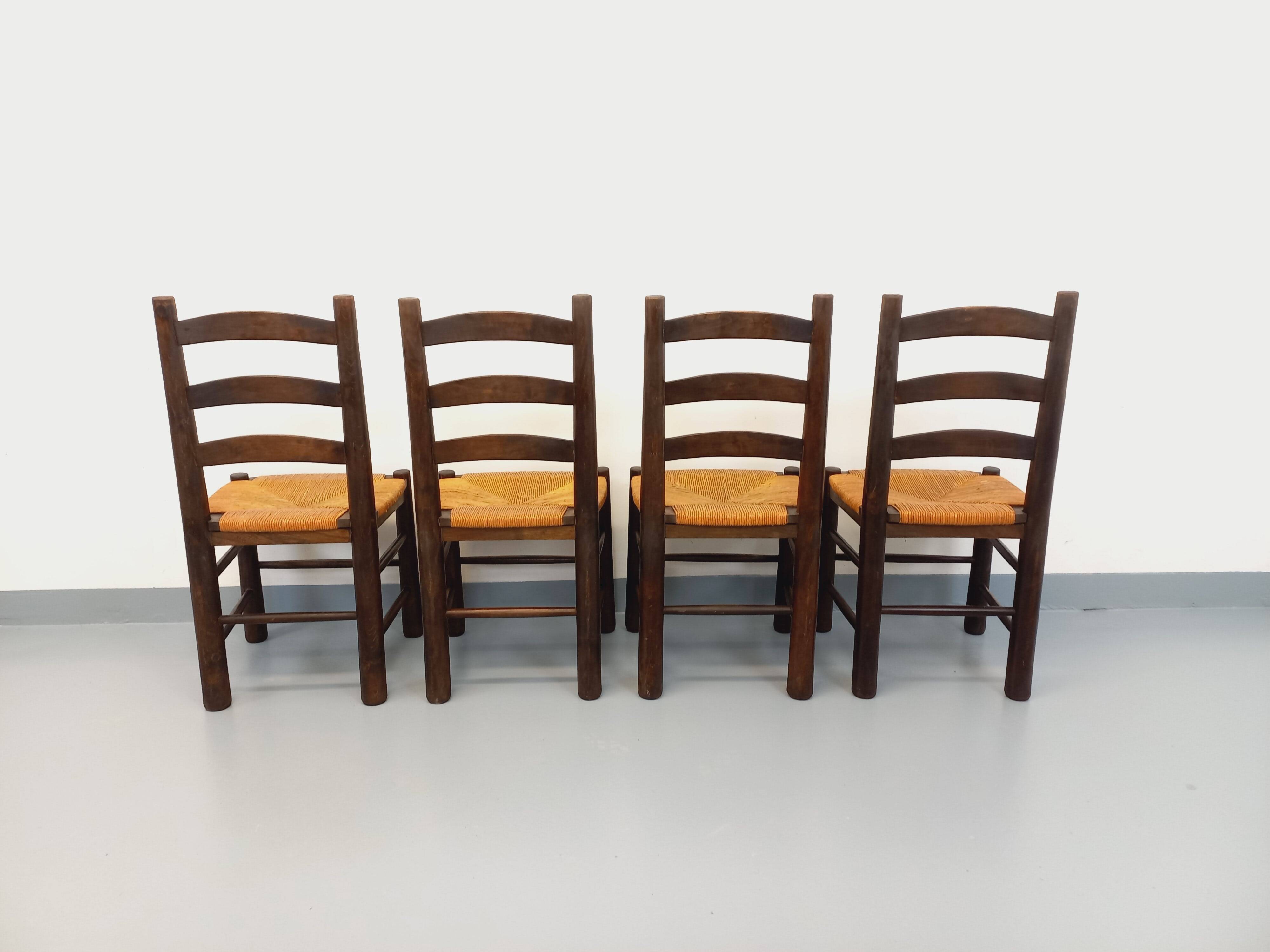 Set of 4 vintage brutalist chairs by Georges Robert in wood and straw.