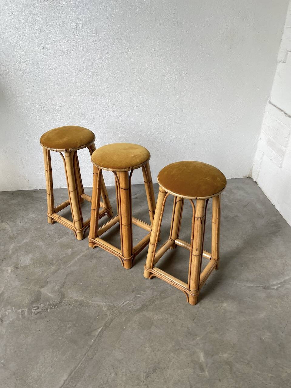 Set of three rattan high stools