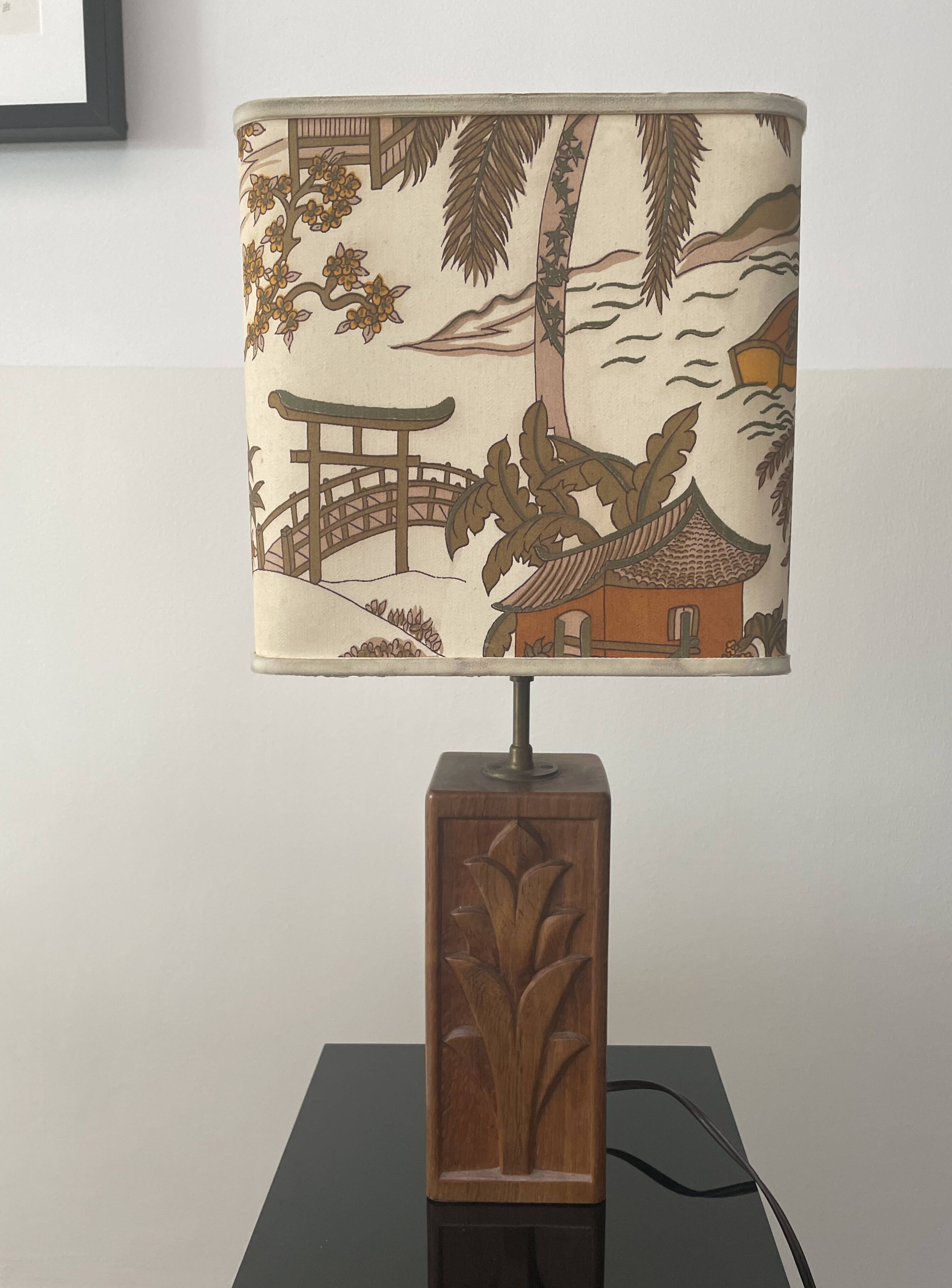Wooden lamp with carved plant decoration from 1930-50, sold with a 1970 lampshade.
