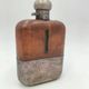 Silver-plated metal flask with leather and glass