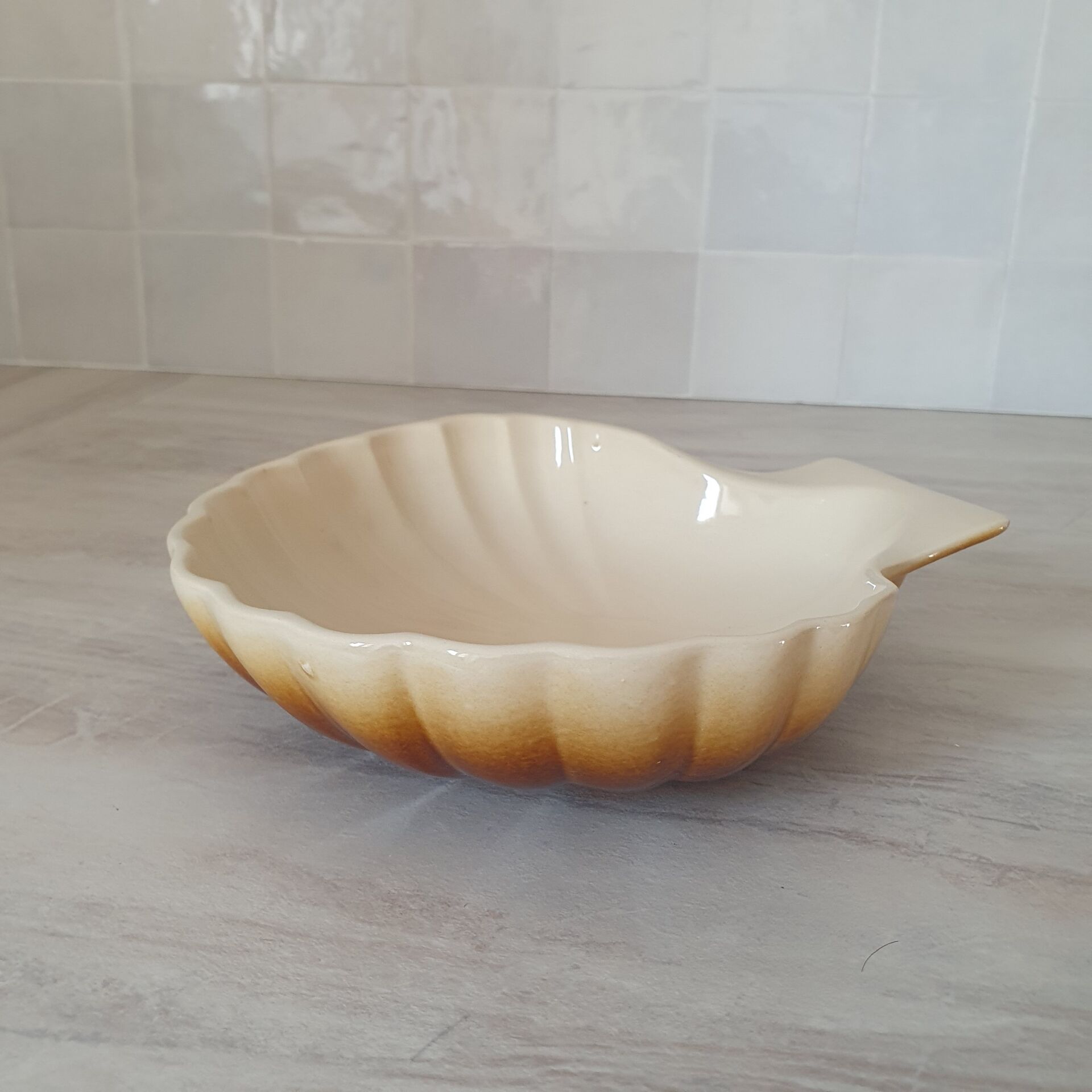 Brown and white ceramic shell bowl
