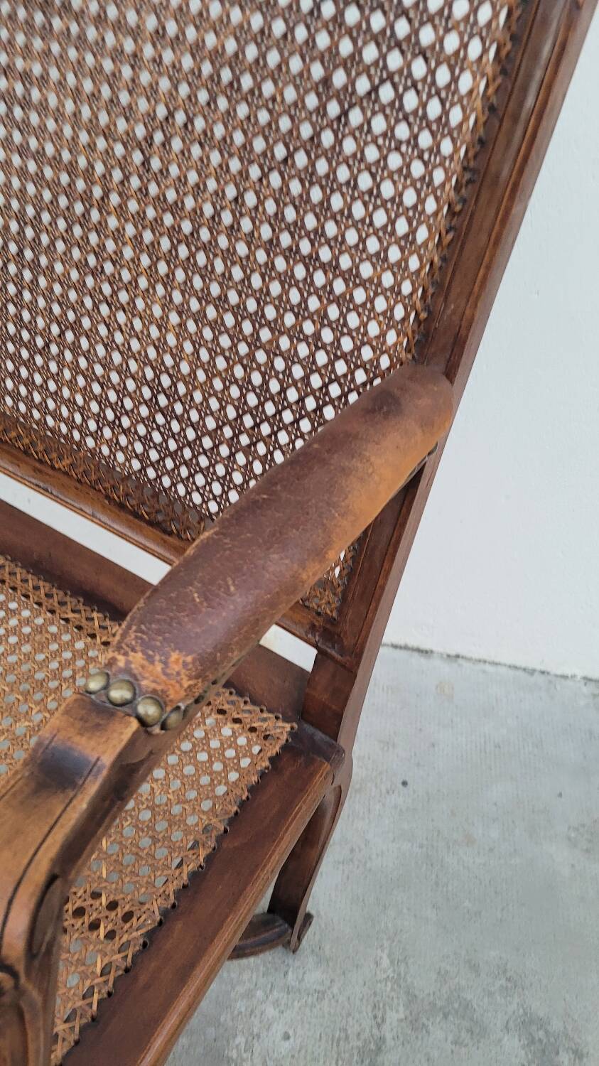 Louis XV Regency cane armchair leather armrests decorated with shell