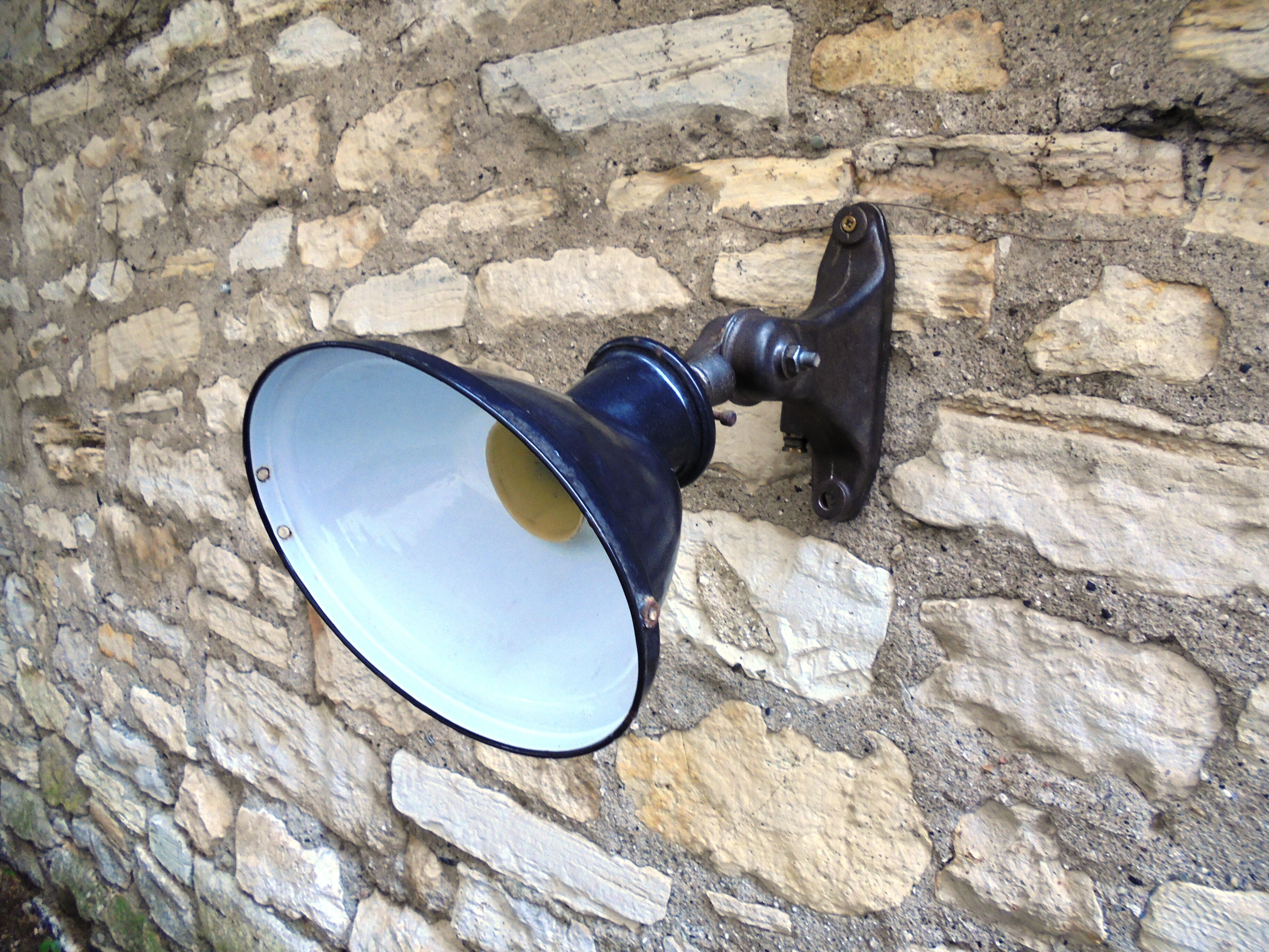 Antique cast iron and enamel wall lamp from the 1930s