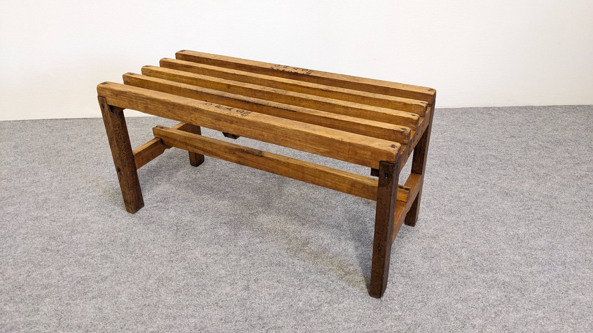 Wooden slatted display bench or support, France circa 1960.