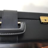 Black soft suitcase with buckle on top