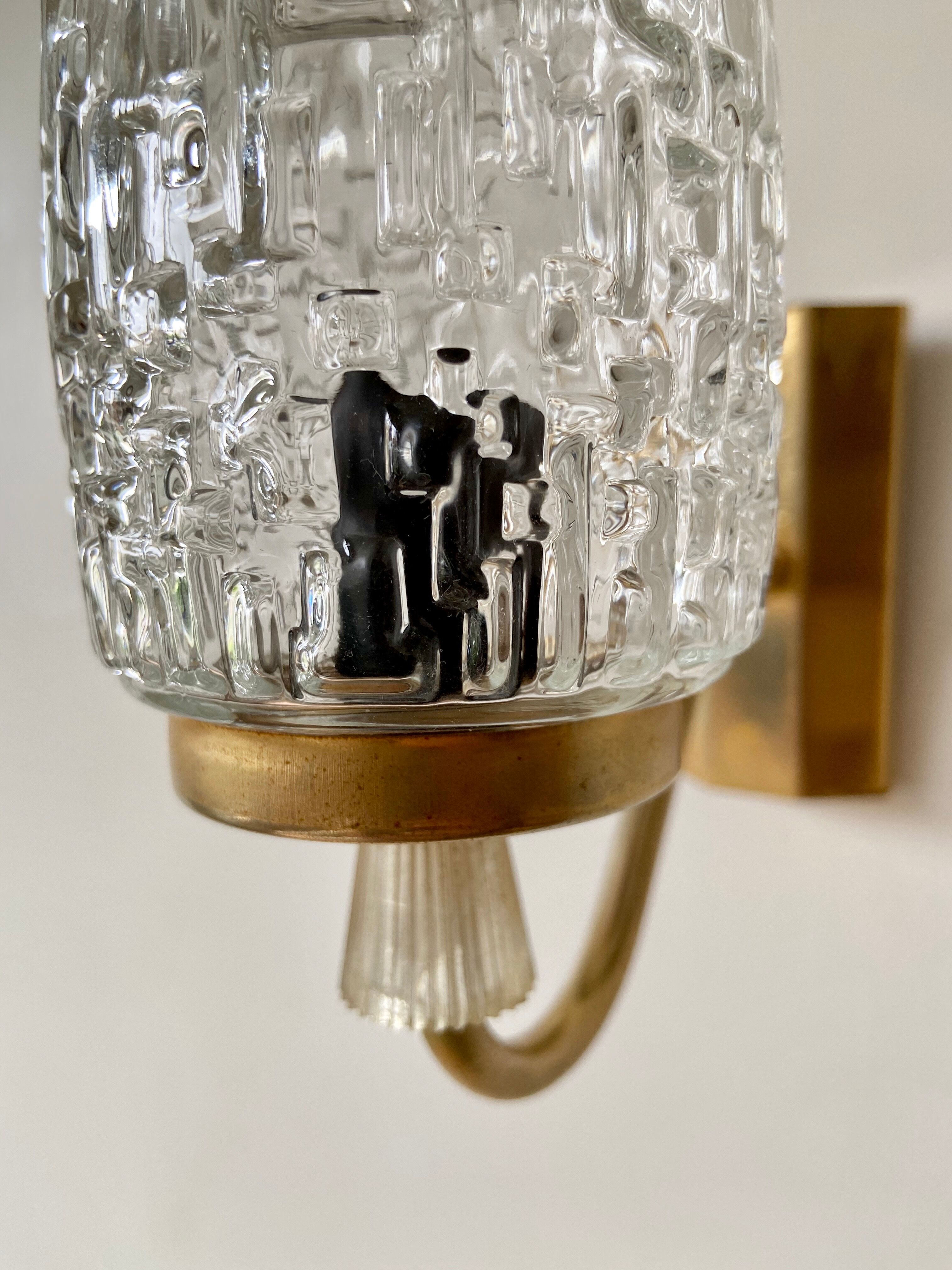 Gold metal and chiseled glass wall sconce