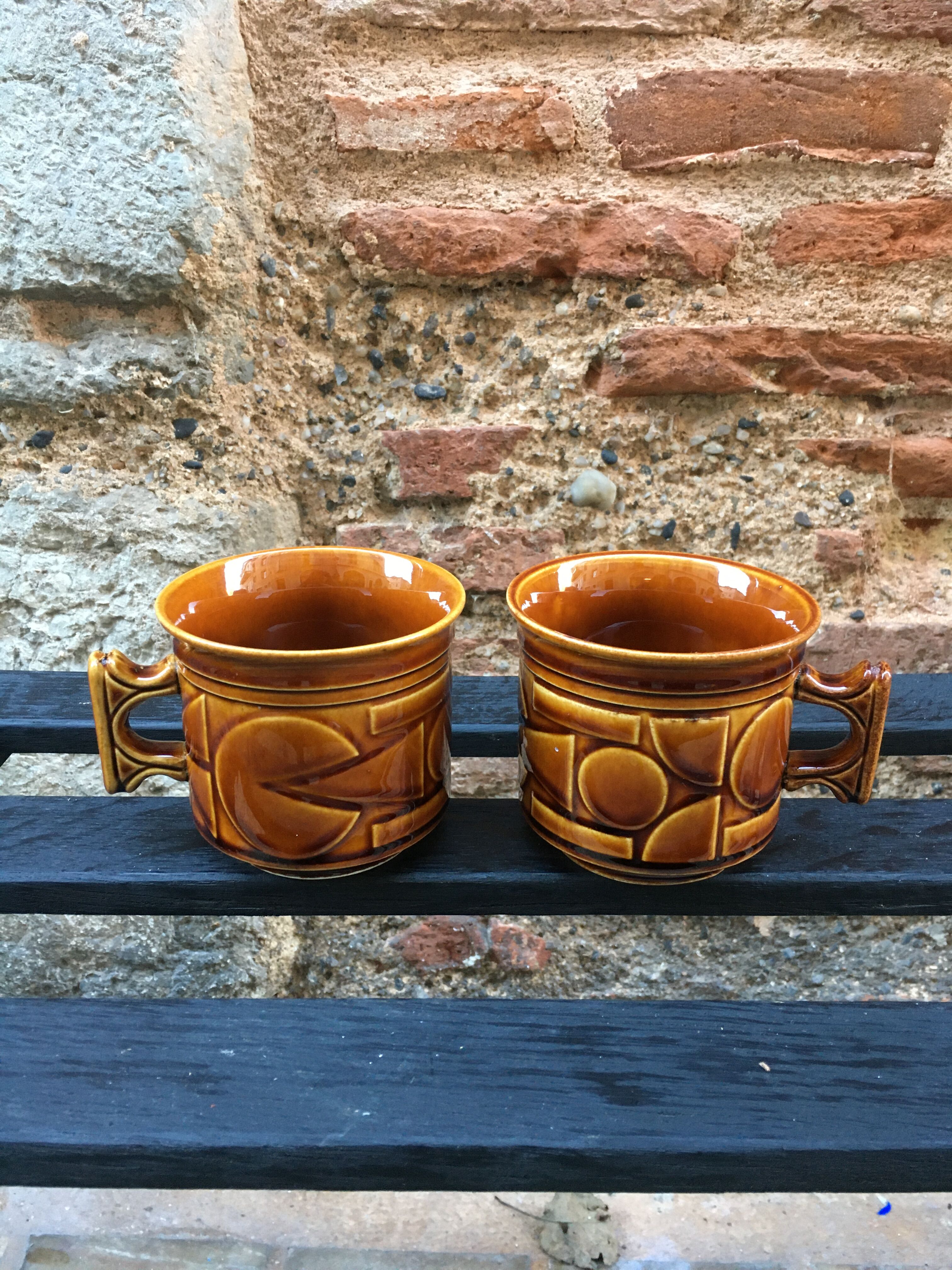 Two brown coffee cups
