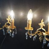 Pair of gilded bronze sconces and crystal pendants