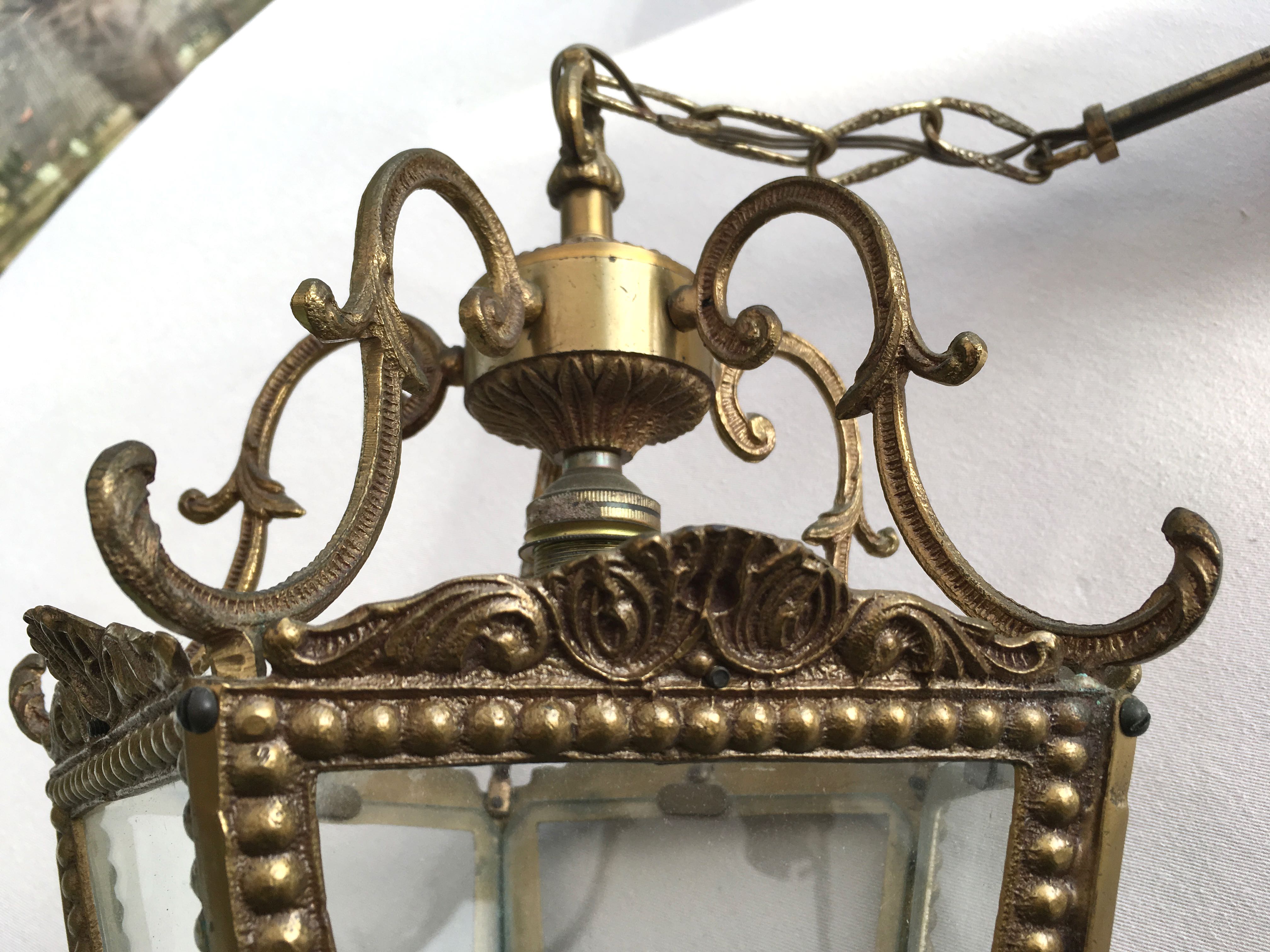 Hanging brass lantern and engraved glass