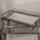 Vintage 1970s rolling dessert trolley in chrome metal and mirrored glass.