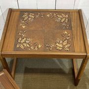 Set of 3 nesting tables in teak with tiled tops.