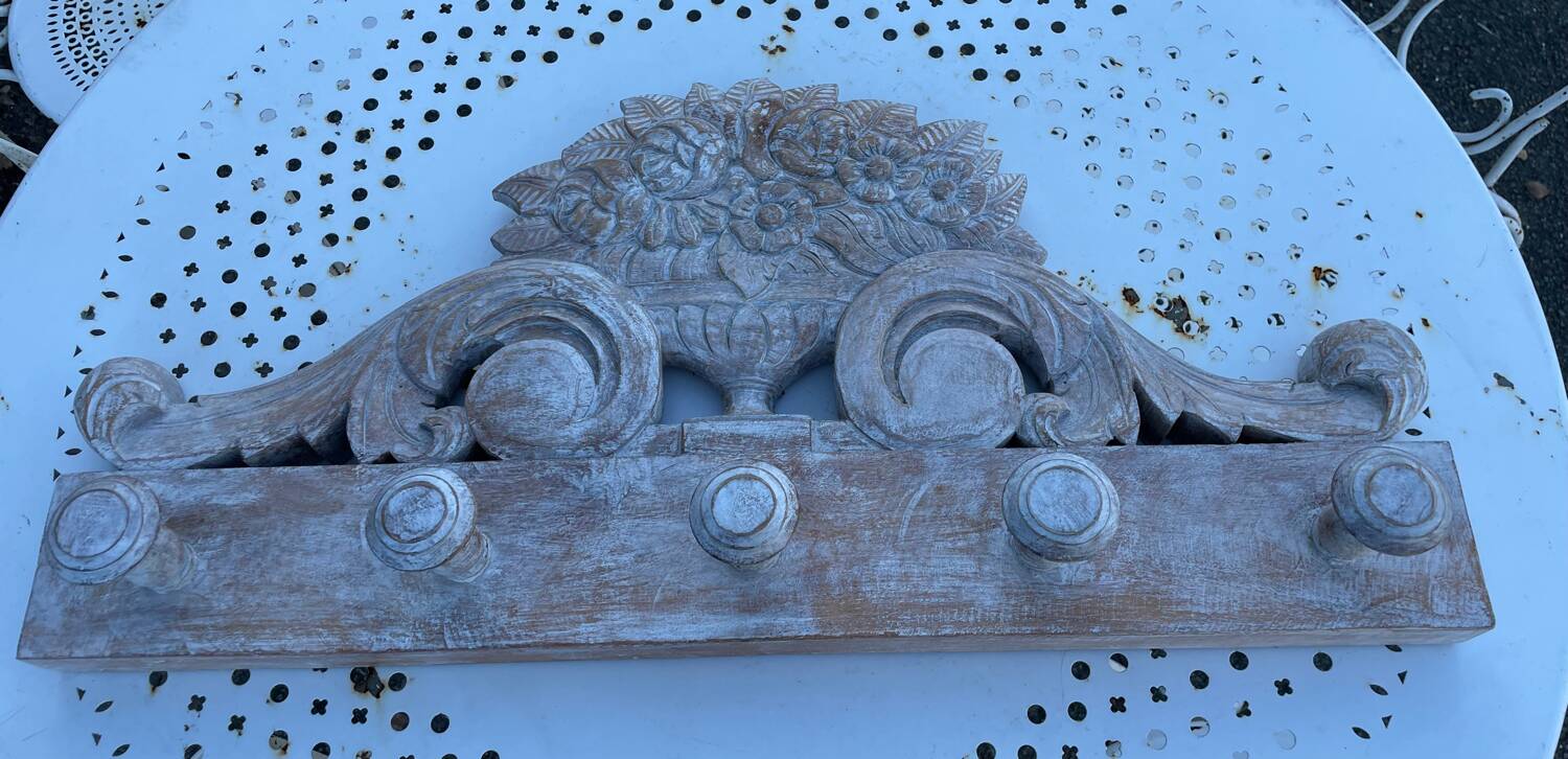 Raw carved wood coat rack