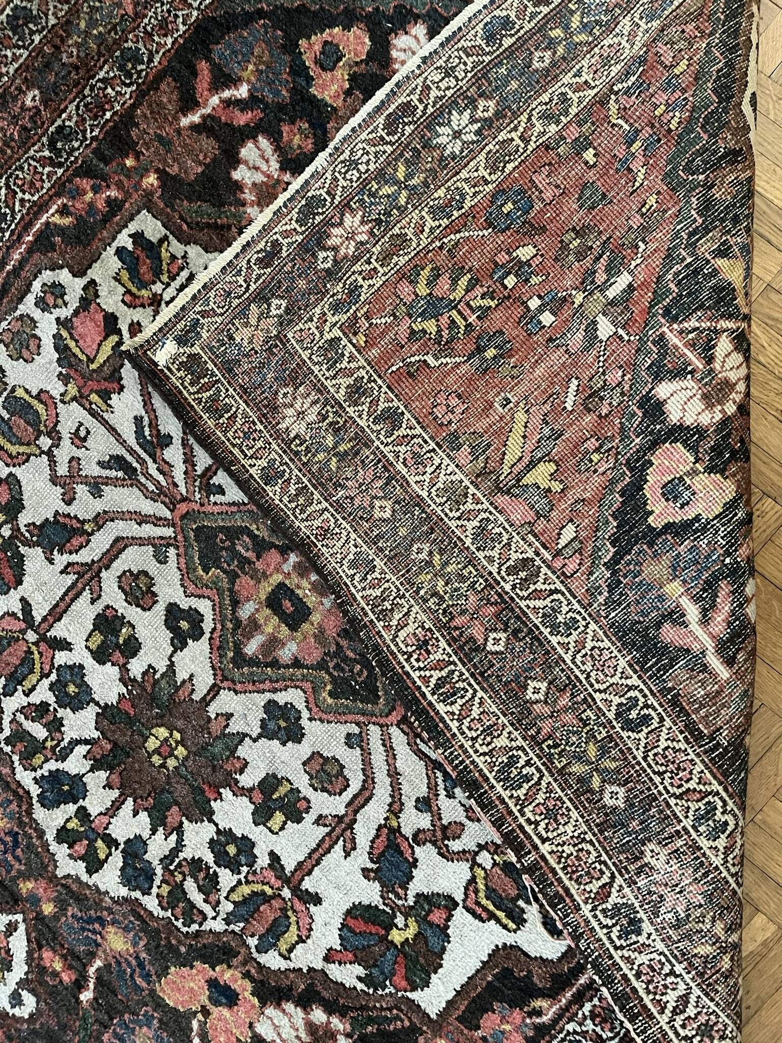 Antique handmade Hamadan Persian rug, ivory medallion on dark background 148x103.