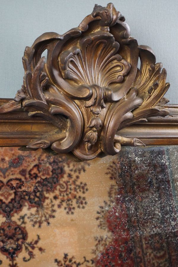 Old French fireplace mirror with beautiful ornament