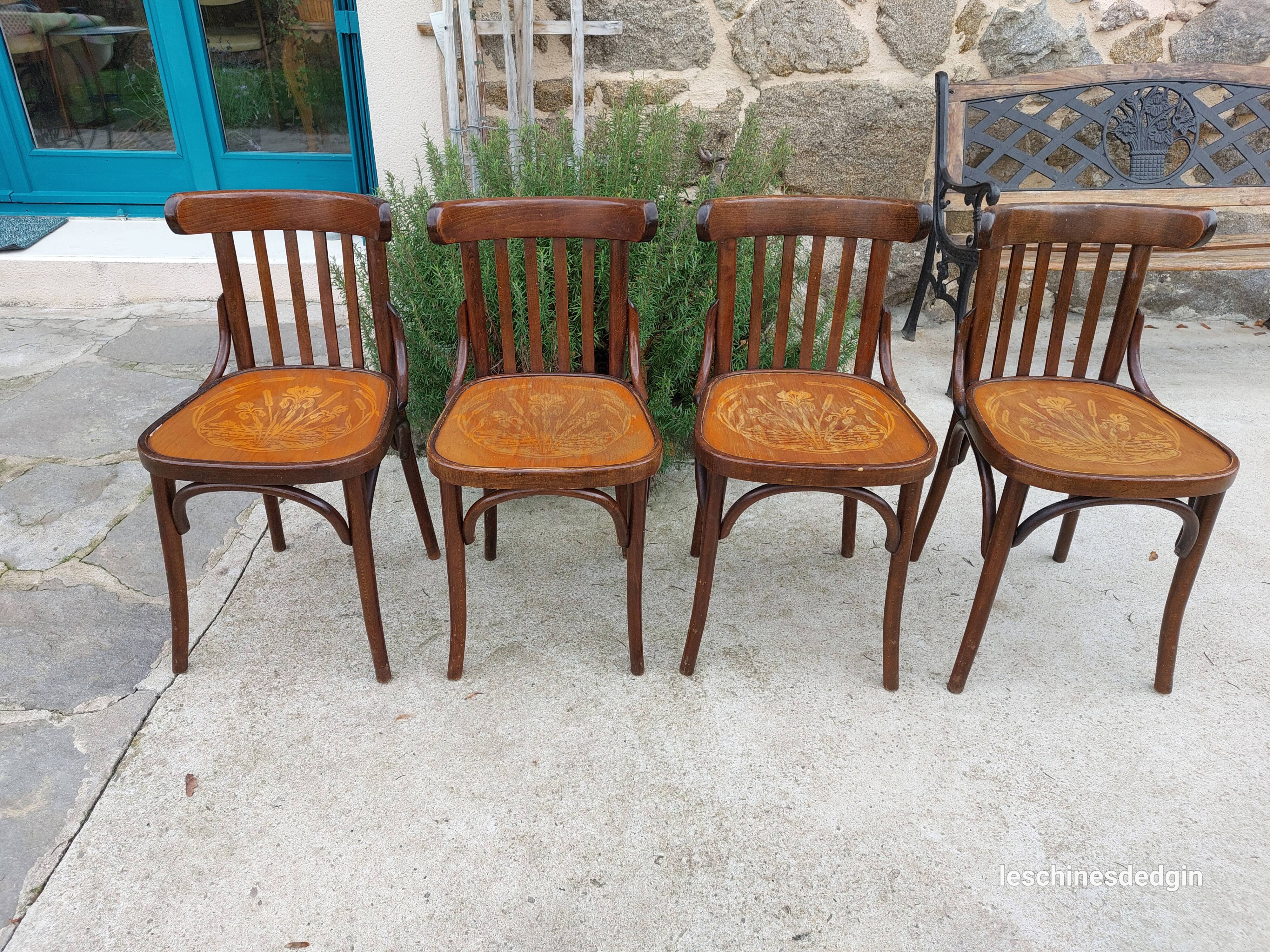 4 bentwood bistro chairs with a pattern on the seat