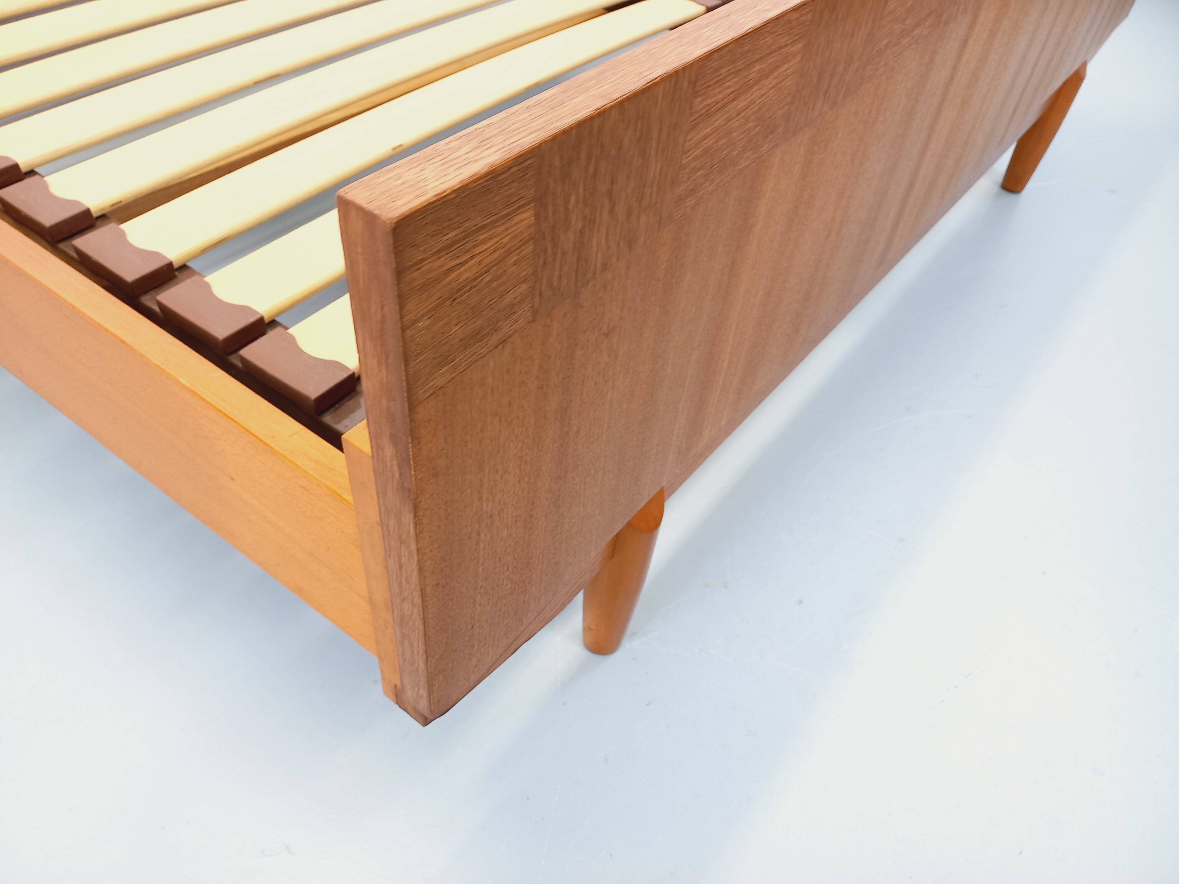 Double bed vintage Scandinavian in teak from the 1960s with integrated bedside tables.