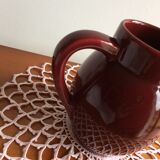 Old dark red ceramic pitcher jug