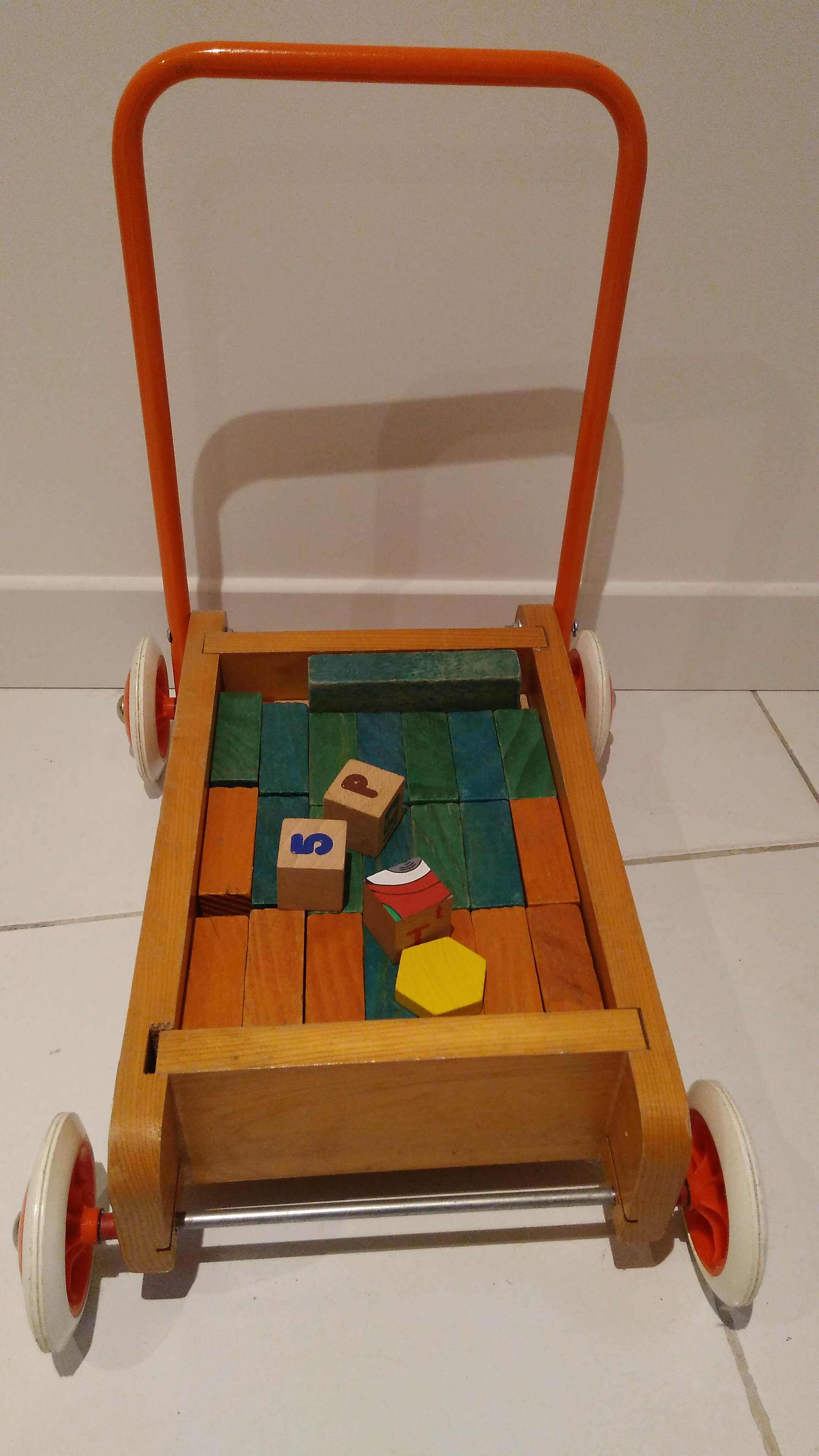 Educational game wood cubes on wheeled cart