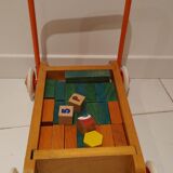Educational game wood cubes on wheeled cart