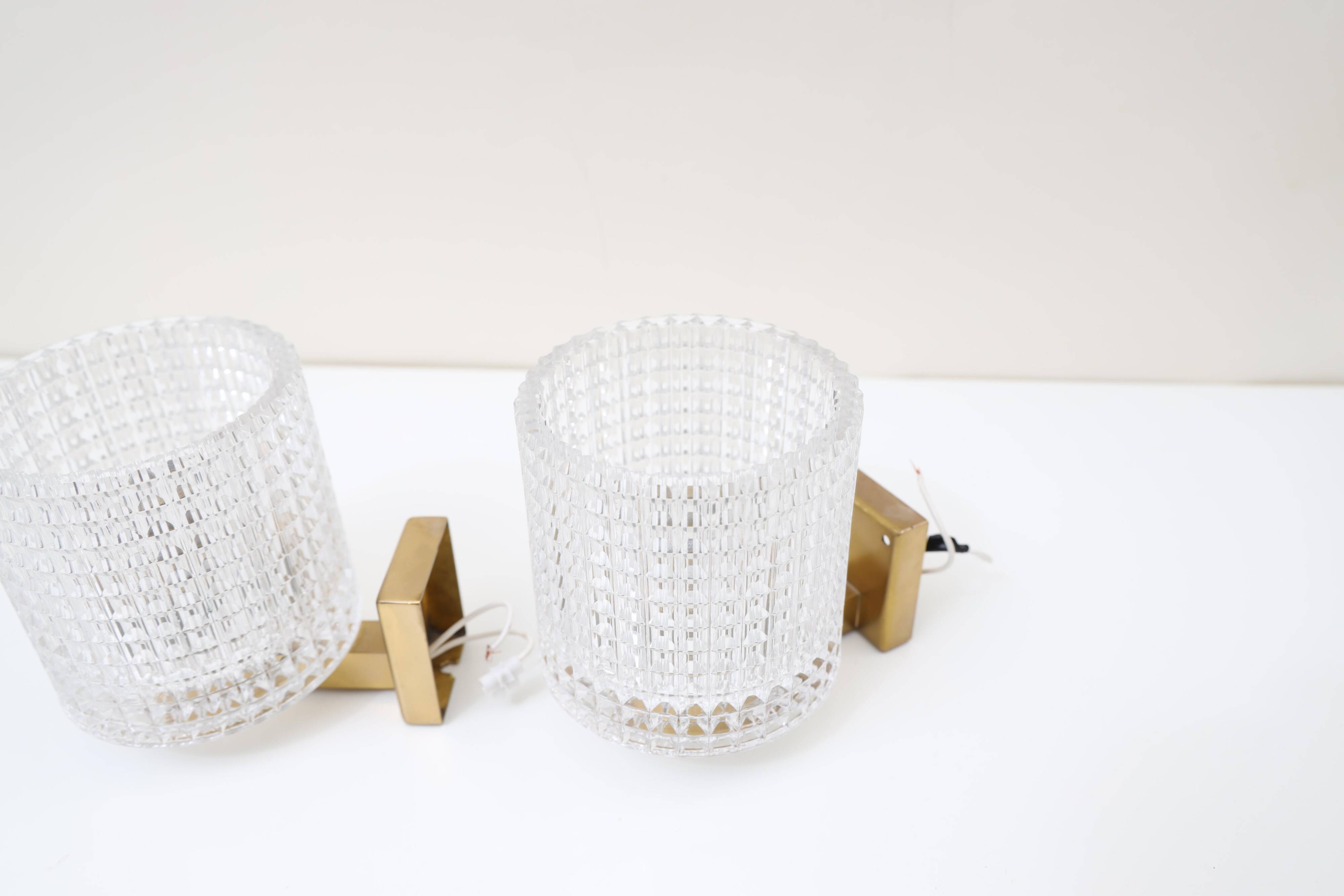 Carl Fagerlund for Orrefors Pair of wall lights in brass and glass Sweden 1960