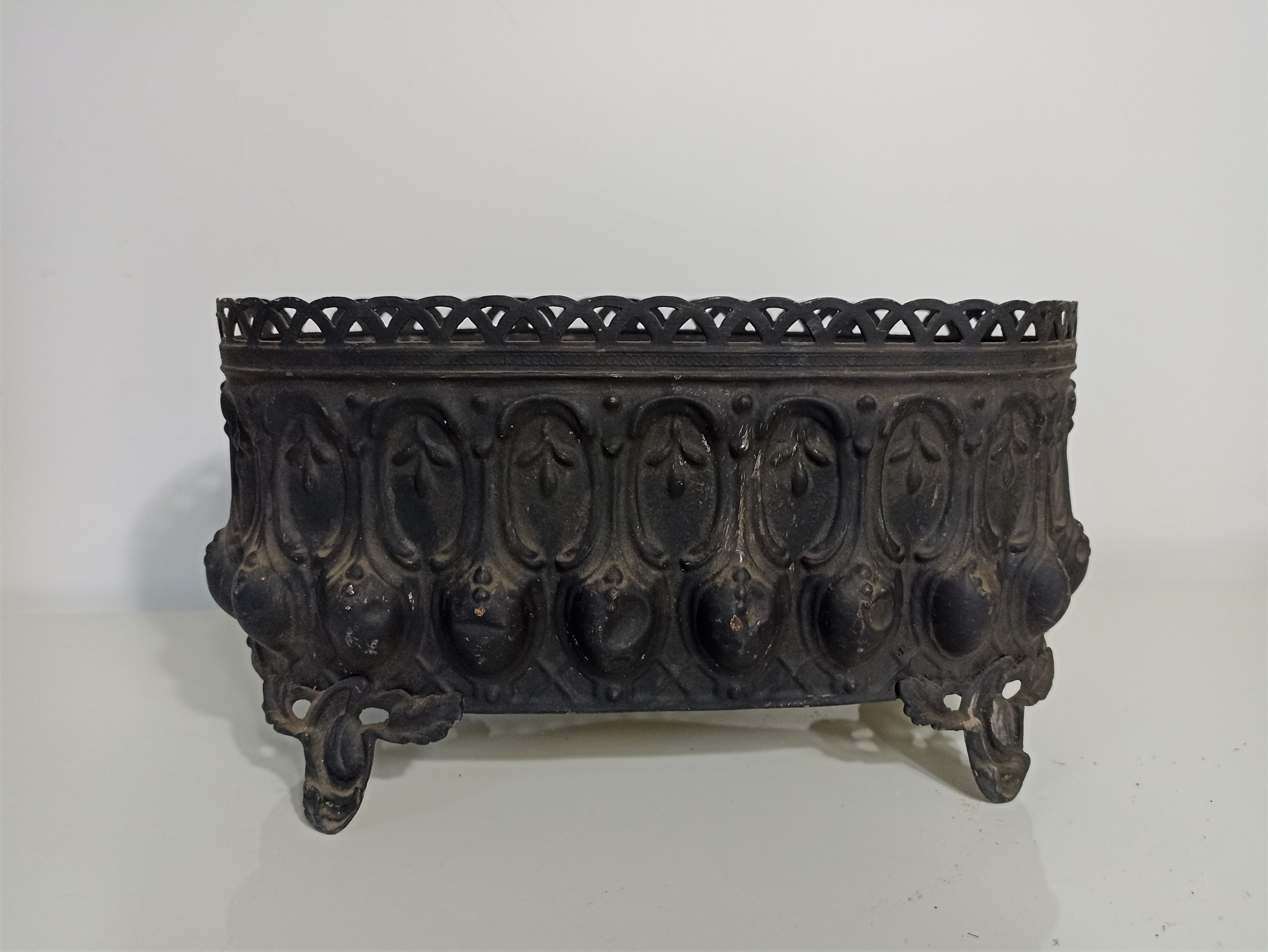 Old black iron planter