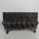 Old black iron planter